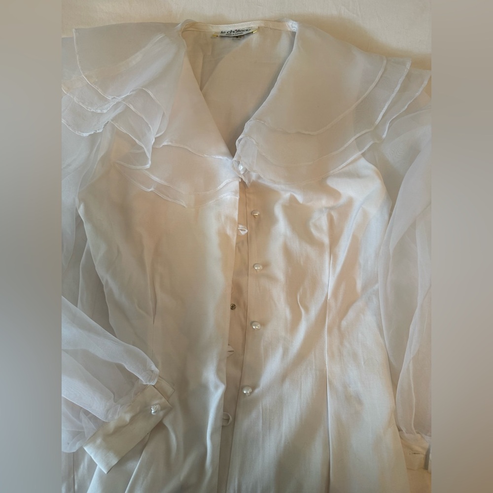 Le Chateau Vintage White Blouse with pearl-like buttons.